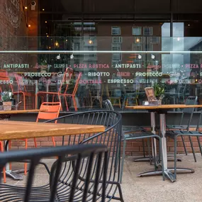 Zizzi Coventry, modern restaurant front with outdoor dining.