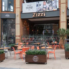 Zizzi Coventry, modern restaurant front with outdoor dining.