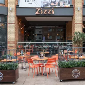 Zizzi Coventry, modern restaurant front with outdoor dining.