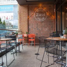 Zizzi Coventry, modern restaurant front with outdoor dining.
