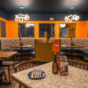 Zizzi High Wycombe, modern-rustic interior with mural art, comfy booths, and open-plan layout.