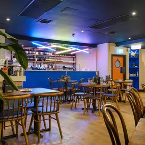 Contemporary dining interior at Zizzi The Strand (West End) with creative design and warm atmosphere.