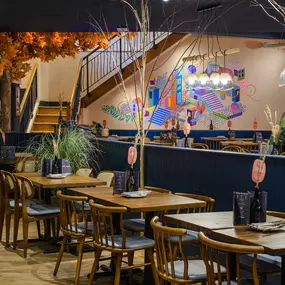 Contemporary dining interior at Zizzi The Strand (West End) with creative design and warm atmosphere.