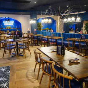 Contemporary dining interior at Zizzi The Strand (West End) with creative design and warm atmosphere.