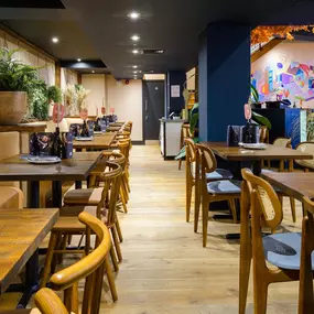 Contemporary dining interior at Zizzi The Strand (West End) with creative design and warm atmosphere.