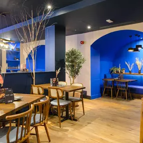 Contemporary dining interior at Zizzi The Strand (West End) with creative design and warm atmosphere.