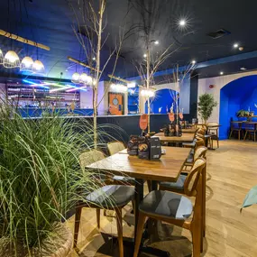 Contemporary dining interior at Zizzi The Strand (West End) with creative design and warm atmosphere.