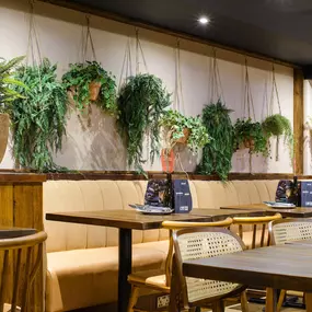 Contemporary dining interior at Zizzi The Strand (West End) with creative design and warm atmosphere.