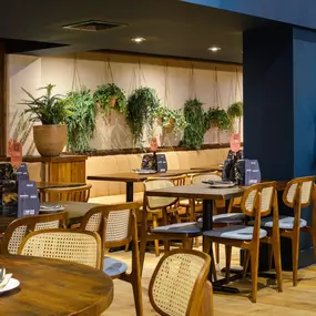 Contemporary dining interior at Zizzi The Strand (West End) with creative design and warm atmosphere.