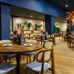 Contemporary dining interior at Zizzi The Strand (West End) with creative design and warm atmosphere.