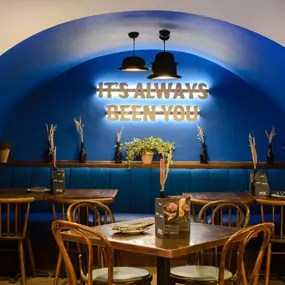 Contemporary dining interior at Zizzi The Strand (West End) with creative design and warm atmosphere.