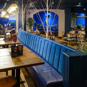 Contemporary dining interior at Zizzi The Strand (West End) with creative design and warm atmosphere.