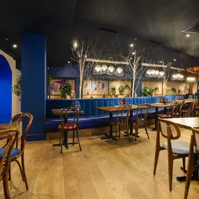 Contemporary dining interior at Zizzi The Strand (West End) with creative design and warm atmosphere.