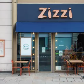 Exterior view of Zizzi The Strand (West End), with bold signage and modern frontage.