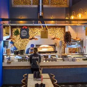 Contemporary dining interior at Zizzi The Strand (West End) with creative design and warm atmosphere.