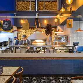 Contemporary dining interior at Zizzi The Strand (West End) with creative design and warm atmosphere.