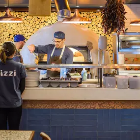 Contemporary dining interior at Zizzi The Strand (West End) with creative design and warm atmosphere.