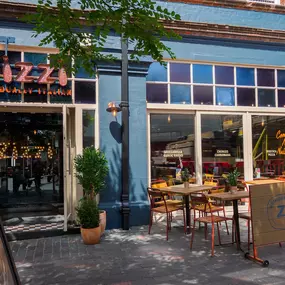 Street view of the Zizzi St Albans restaurant entrance and front of restaurant dining area.