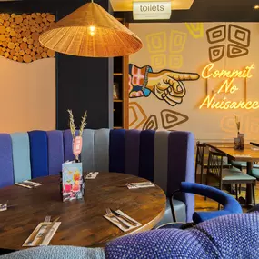 Stylish dining area at Zizzi St Albans with modern decor and natural accents.