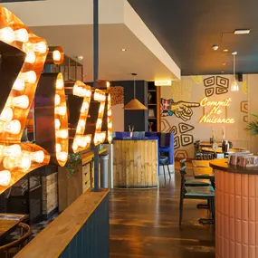 Stylish dining area at Zizzi St Albans with modern decor and natural accents.
