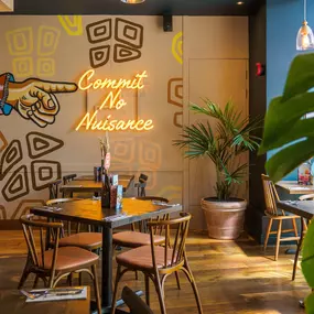 Stylish dining area at Zizzi St Albans with modern decor and natural accents.