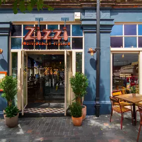 Street view of the Zizzi St Albans restaurant entrance and front of restaurant dining area.