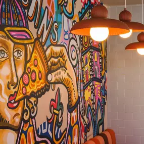 Stylish dining area at Zizzi St Albans with modern decor and natural accents.