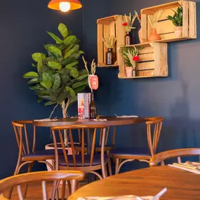 Stylish dining area at Zizzi St Albans with modern decor and natural accents.