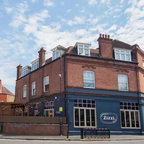 Street view of the Zizzi St Albans restaurant entrance and front of restaurant dining area.