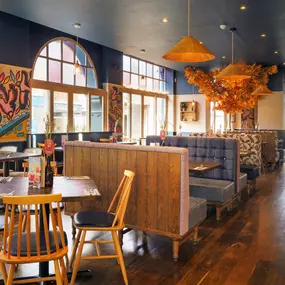 Stylish dining area at Zizzi St Albans with modern decor and natural accents.