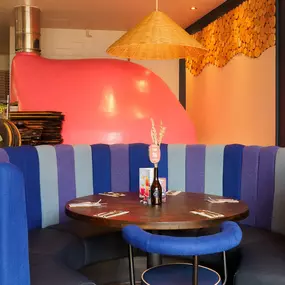 Stylish dining area at Zizzi St Albans with modern decor and natural accents.