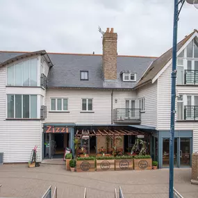 Seaside Zizzi Whitstable exterior with nautical charm and welcoming  entrance featuring outdoor dining area