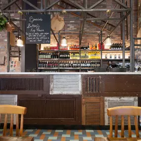 Stylish dining area at Zizzi Cardiff St David's with modern decor and natural accents.