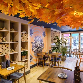 Zizzi Basingstoke, warm seating area with canopy ceiling décor.