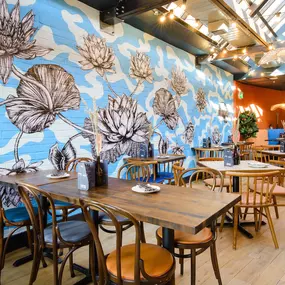 Zizzi Basingstoke, bright dining space with feature mural and skylight