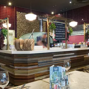 Stylish dining area at Zizzi Manchester Piccadilly with modern decor and natural accents.