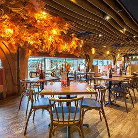 Zizzi Bankside, a rustic-modern interior with warm lighting.