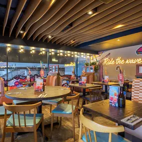 Zizzi Bankside, a rustic-modern interior with warm lighting.