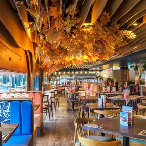 Zizzi Bankside, a rustic-modern interior with warm lighting.