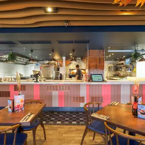 Zizzi Bankside, a rustic-modern interior with warm lighting.