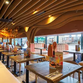 Zizzi Bankside, a rustic-modern interior with warm lighting.