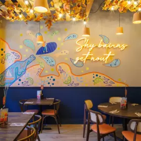 Stylish dining area at Zizzi Newcastle with modern decor and natural accents.