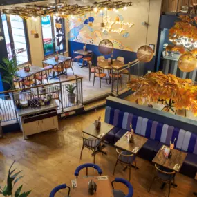 Stylish dining area at Zizzi Newcastle with modern decor and natural accents.