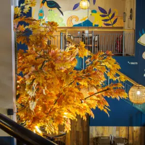 Stylish dining area at Zizzi Newcastle with modern decor and natural accents.