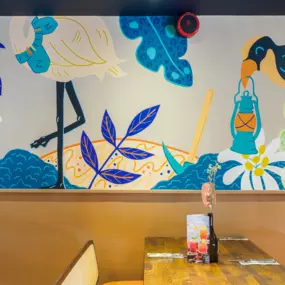 Stylish dining area at Zizzi Newcastle with modern decor and natural accents.