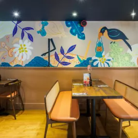 Stylish dining area at Zizzi Newcastle with modern decor and natural accents.