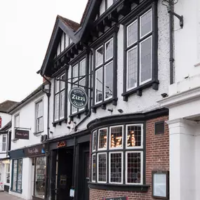 Exterior of Zizzi Henley housed in a historic timber-framed coach house.