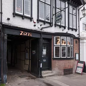 Exterior of Zizzi Henley housed in a historic timber-framed coach house.