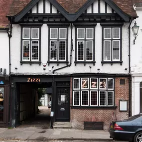 Exterior of Zizzi Henley housed in a historic timber-framed coach house.