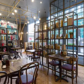 Stylish dining area at Zizzi Bradford with modern decor and natural accents.